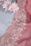 Elegant Crush Tissue saree in peach pink with a stunning mirror work blouse