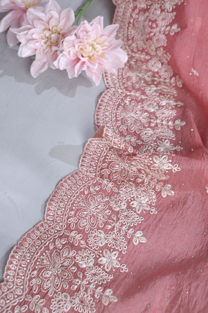 Elegant Crush Tissue saree in peach pink with a stunning mirror work blouse