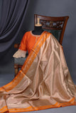 Banarasi brocade tissue saree in champagne with a beautiful light orange border
