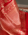 Red Banarasi Saree with a sleeveless blouse