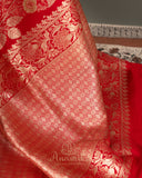 Red Banarasi Saree with a sleeveless blouse