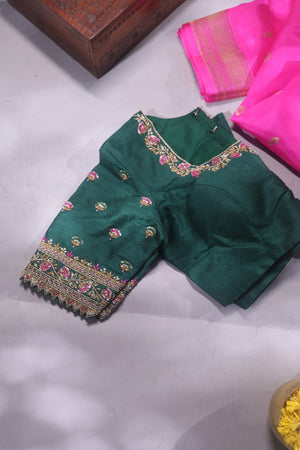 Raw Mango saree in bubble gum pink paired with a contrast dark green blouse