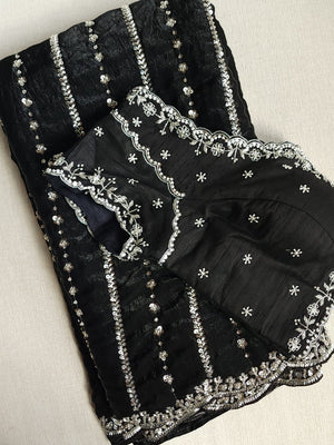 Falling organza saree in black with all over sequins work