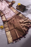 Kanchipattu saree in a lovely shade of light peach with a contrast dark maroon border
