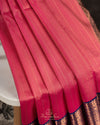 Kanchipattu saree in lovely rose pink shade with a contrast dark blue border