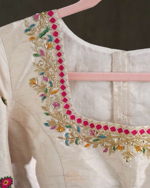 Off white blouse with beautifully designed Patola-inspired embroidery