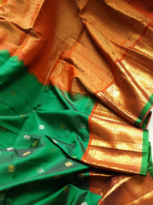 Traditional Green and rust orange Kanchipattu saree