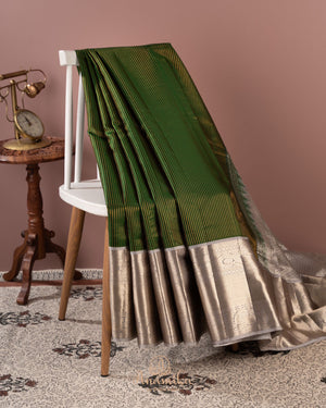 Dark green kanjeevaram saree with contrast grey border and pallu
