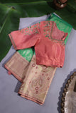 Green Kanjeevaram saree with a peach pink border