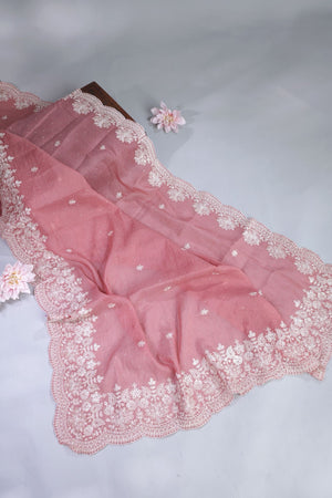 Elegant Crush Tissue saree in peach pink with a stunning mirror work blouse