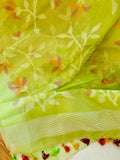 Lime Green Muslin Jamdaani saree with a peach pink crush tissue work blouse