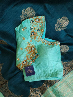 Peacock Green with aqua blue rawsilk saree with a stylish blouse