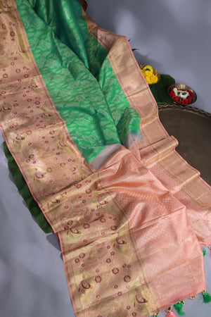 Green Kanjeevaram saree with a peach pink border