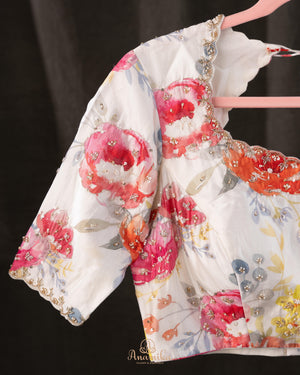 A beautiful Floral blouse in off white with intricately designed embroidery