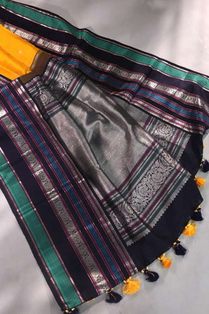 Kanjeevaram saree in a stunning shade of yellow and black