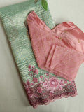 Crush tissue saree in aqua green with floral cutwork border