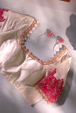 Off white blouse with hot pink embroidered sleeve panel