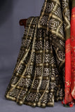 Bandini Gharchola in a lovely olive green shade with kalamkari pallu