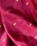 Raw mango pattu saree in a lovely shade of pink paired with a contrast floral blouse