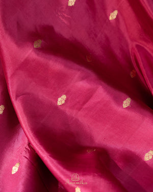 Raw mango pattu saree in a lovely shade of pink paired with a contrast floral blouse