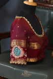 Peach and maroon kanjeevaram with floral applique border