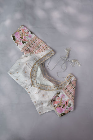 A beautiful rose pink tissue saree with an off white blouse