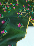 Bottle Green Jamdaani saree paired with a contrast yellow paithani blouse