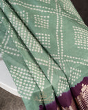 Sage Green Kanchi Bandini saree with a stunning purple border