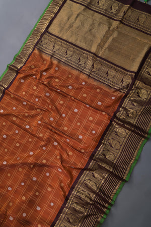 Rich kanjeevaram saree in rust orange and brown border