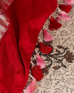 Pink Banarasi kora with a beautiful contrast red meenakari floral border