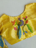 Bottle Green Jamdaani saree paired with a contrast yellow paithani blouse
