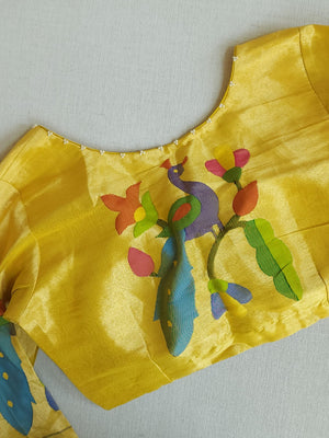 Bottle Green Jamdaani saree paired with a contrast yellow paithani blouse