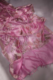 A beautiful rose pink tissue saree with an off white blouse