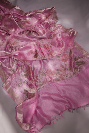 A beautiful rose pink tissue saree with an off white blouse