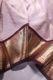 Kanchipattu saree in a lovely shade of light peach with a contrast dark maroon border