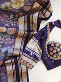 A purple Kota silk saree with beautiful floral prints