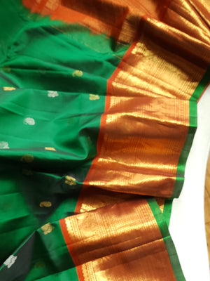 Traditional Green and rust orange Kanchipattu saree