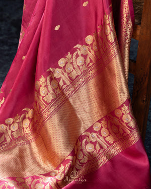 Raw mango pattu saree in a lovely shade of pink paired with a contrast floral blouse