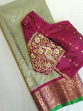 A Royal Gadwal kanchi saree in sage green with rich magenta border