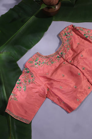 Green Kanjeevaram saree with a peach pink border