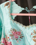 A beautiful Floral blouse in pastel blue with intricately designed embroidery