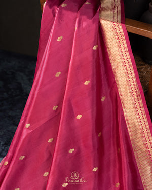 Raw mango pattu saree in a lovely shade of pink paired with a contrast floral blouse