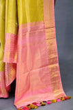 A dreamy kanjeevaram saree in a pastel lime shade