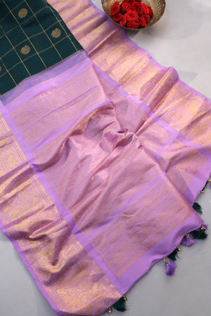 Gadwal pattu saree in the most beautiful dark green and lavender combo
