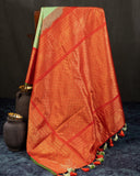 Gadwal Pattu saree in mint green and orange combo