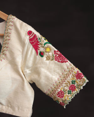Off white blouse with beautifully designed Patola-inspired embroidery