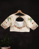 Off white blouse with beautifully designed Patola-inspired embroidery