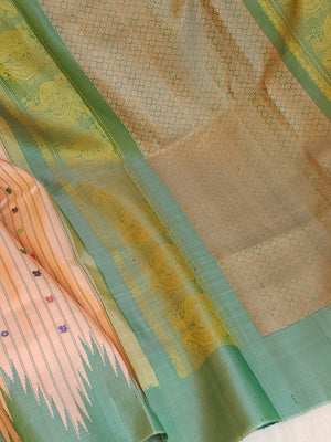 Gadwal saree in peach with beautiful contrast green temple borders