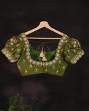 Soft organza saree in green with a beautifully embroidered blouse
