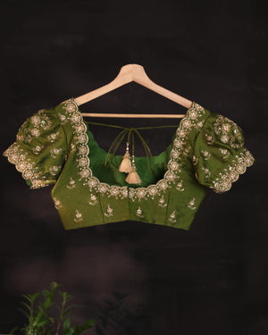 Soft organza saree in green with a beautifully embroidered blouse